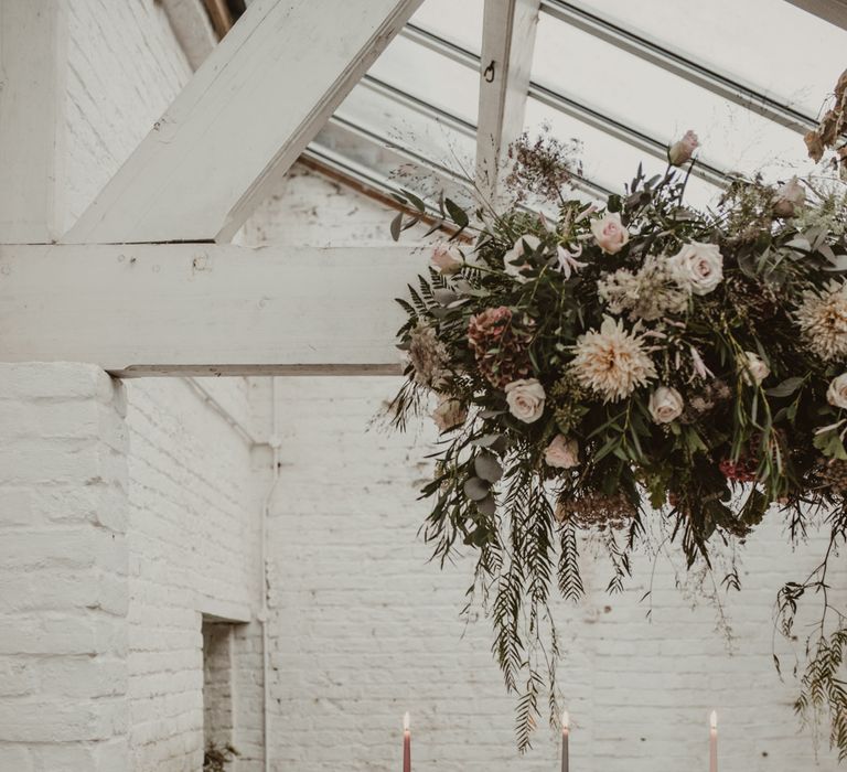 Hanging Floral Installation &amp; Tablescape with Floral Centrepieces &amp; Taper Candles | Romantic Pink and Gold Wedding Inspiration in a Modern Summer House at Garthmyl Hall by KnockKnockPenny Studio | Nesta Lloyd Photography