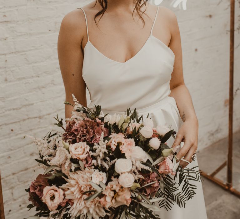 Hanging Neon Happily Ever After Sign on Cooper Frame Wedding Decor | Beautiful Bride in Spaghetti Strap Dress &amp; Star Headdress | Romantic Pink and Gold Wedding Inspiration in a Modern Summer House at Garthmyl Hall by KnockKnockPenny Studio | Nesta Lloyd Photography