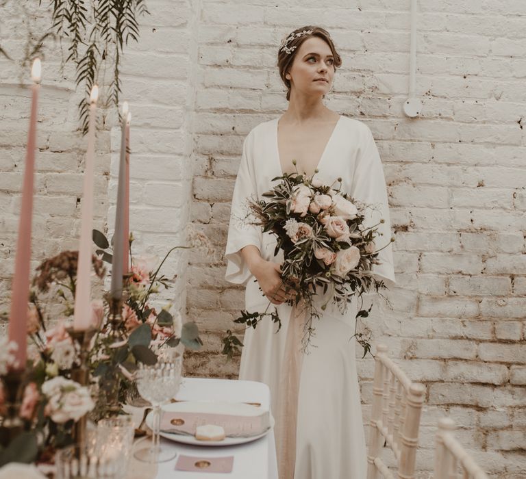 Hanging Floral Installation &amp; Tablescape with Floral Centrepieces &amp; Taper Candles | Beautiful Bride in Wrap Wedding Dress &amp; Vine Headpiece with Baby Pink Rose Bouquet | Romantic Pink and Gold Wedding Inspiration in a Modern Summer House at Garthmyl Hall by KnockKnockPenny Studio | Nesta Lloyd Photography