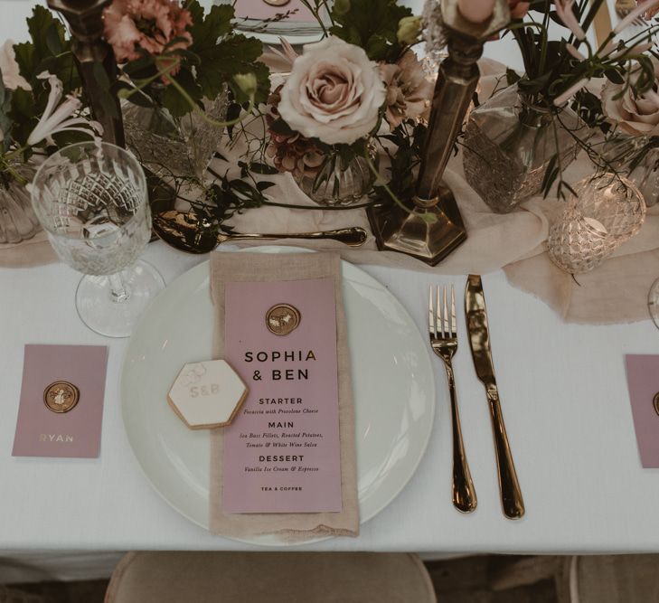 Place Setting with Pink &amp; Gold Foil Menu Card with Wax Seal by Knockknockpenny Studio  on a Tablescape with Floral Centrepieces &amp; Taper Candles | Romantic Pink and Gold Wedding Inspiration in a Modern Summer House at Garthmyl Hall by KnockKnockPenny Studio | Nesta Lloyd Photography