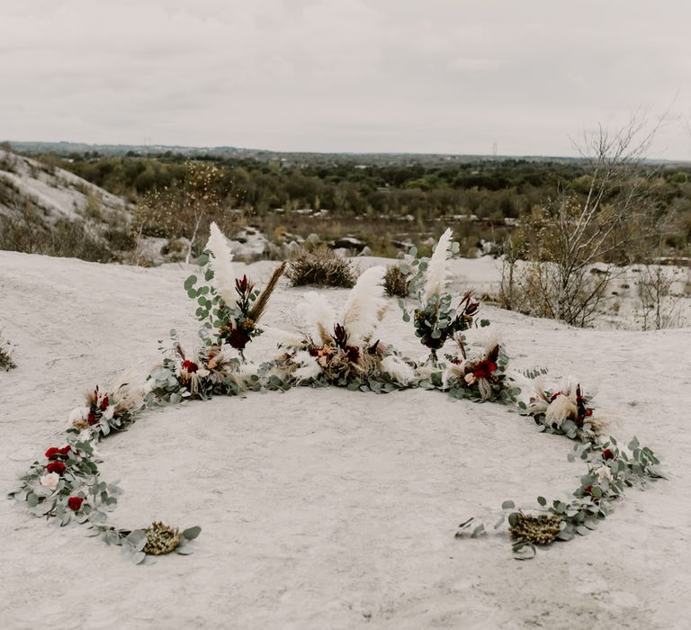 Horseshoe Pampas Grass, Eucalyptus &amp; Red Rose Floral Arrangement | Wild Same Sex Couple Wedding Inspiration Shoot | Anne Letournel Photography