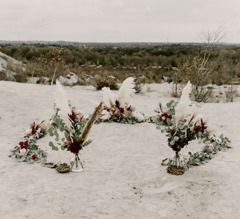 Horseshoe Pampas Grass, Eucalyptus &amp; Red Rose Floral Arrangement | Wild Same Sex Couple Wedding Inspiration Shoot | Anne Letournel Photography