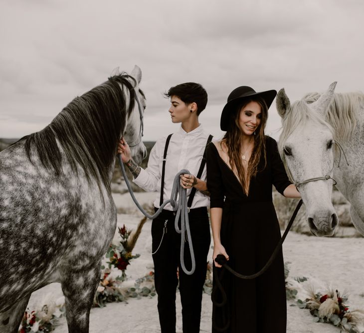 Horses | Bride in Portez Vos Idées Black Wedding Dress | Bride in Black Trousers, White Shirt &amp; Braces | Wild Same Sex Couple Wedding Inspiration Shoot | Anne Letournel Photography