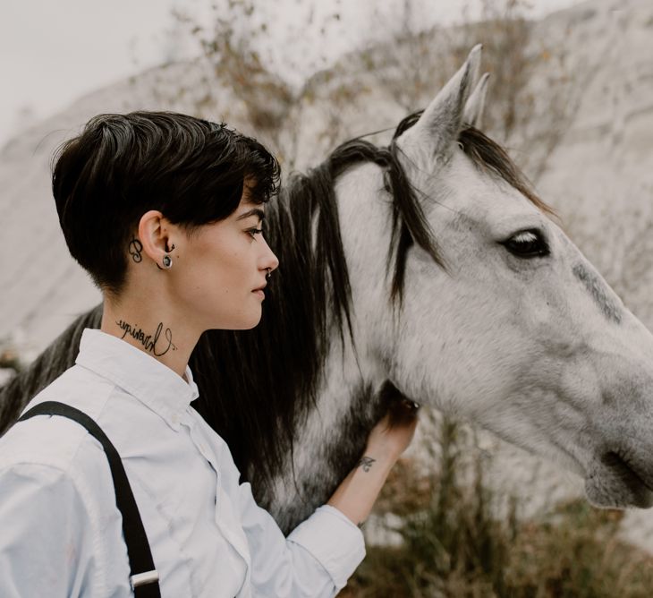 Horse | Bride in Black Trousers, White Shirt &amp; Braces | Wild Same Sex Couple Wedding Inspiration Shoot | Anne Letournel Photography