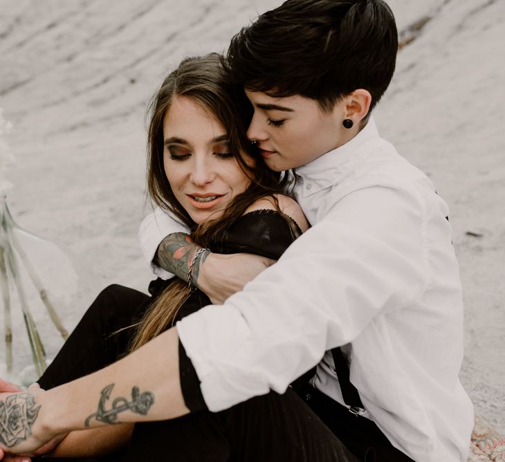 Bride in Portez Vos Idées Black Wedding Dress | Bride in Black Trousers, White Shirt &amp; Braces | Wild Same Sex Couple Wedding Inspiration Shoot | Anne Letournel Photography