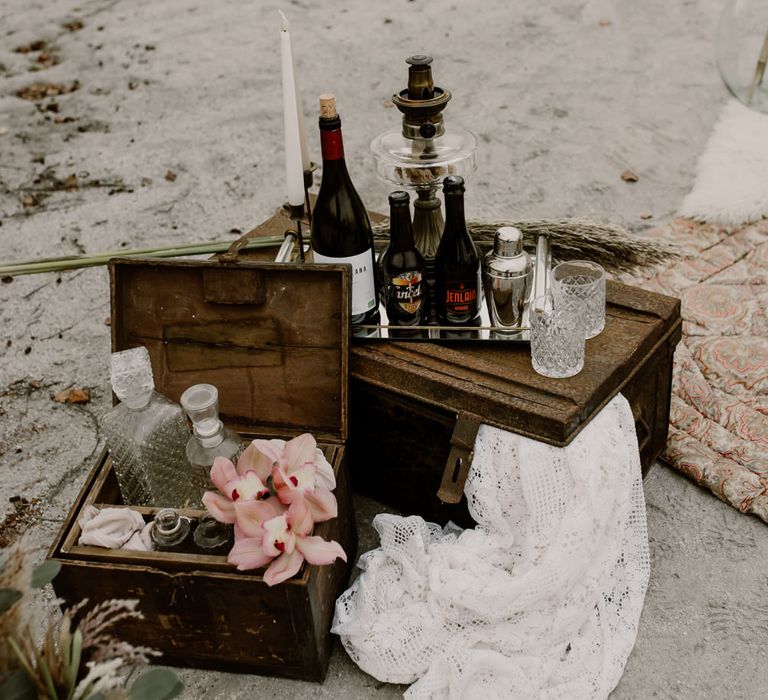 Wooden Crates, Decanters &amp; Candle Sticks Wedding Decor | Wild Same Sex Couple Wedding Inspiration Shoot | Anne Letournel Photography