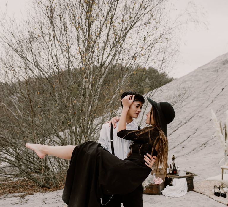 Bride in Portez Vos Idées Black Wedding Dress | Bride in Black Trousers, White Shirt &amp; Braces | Wild Same Sex Couple Wedding Inspiration Shoot | Anne Letournel Photography