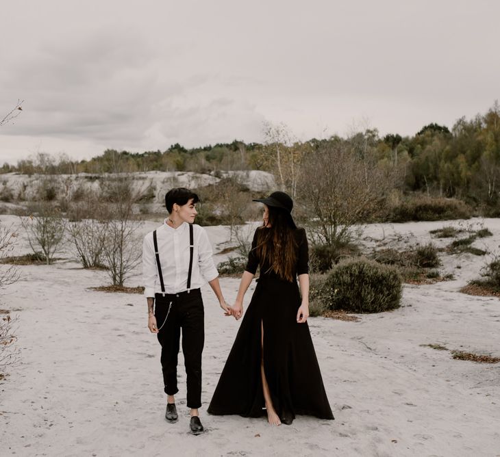 Bride in Portez Vos Idées Black Wedding Dress | Bride in Black Trousers, White Shirt &amp; Braces | Wild Same Sex Couple Wedding Inspiration Shoot | Anne Letournel Photography