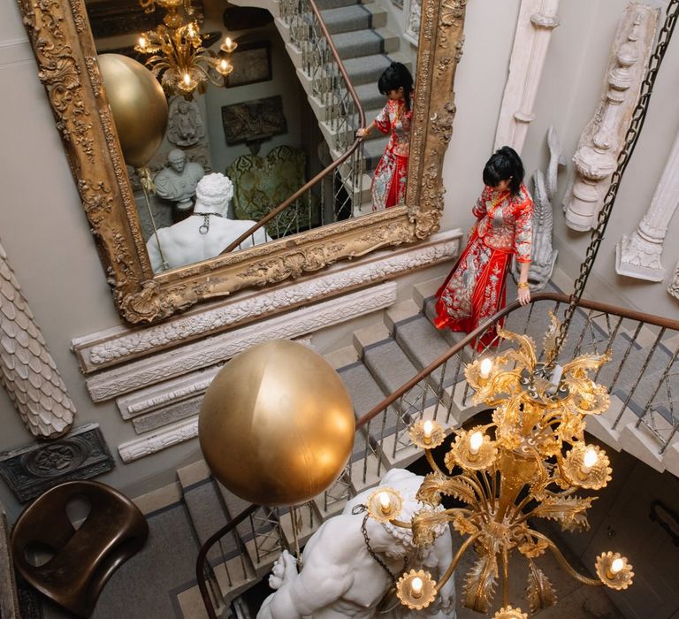 Bride in red dress for Chinese tea ceremony