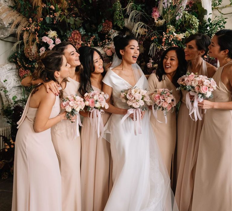 Bridal party portrait with bridesmaids in pale pink dresses