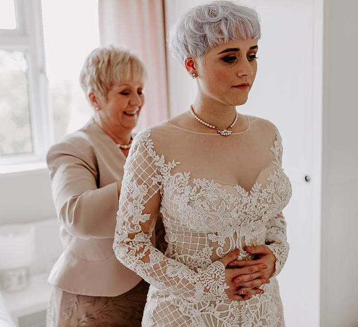 Bride getting ready on the wedding morning in a Lillian West wedding dress