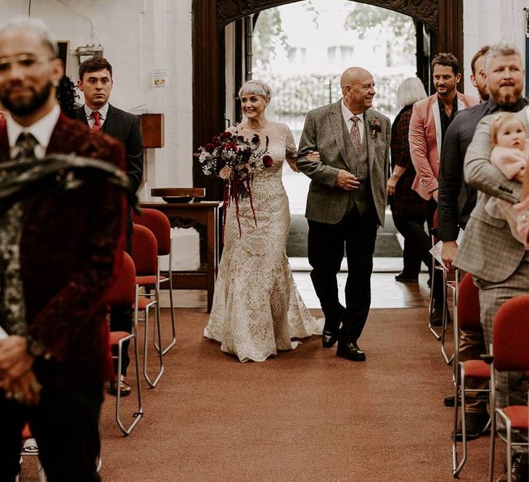 Church wedding ceremony bridal entrance in Lillian West wedding dress