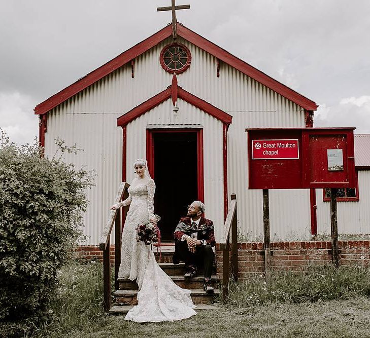 Bride in Lillian West wedding dress and groom in blazer