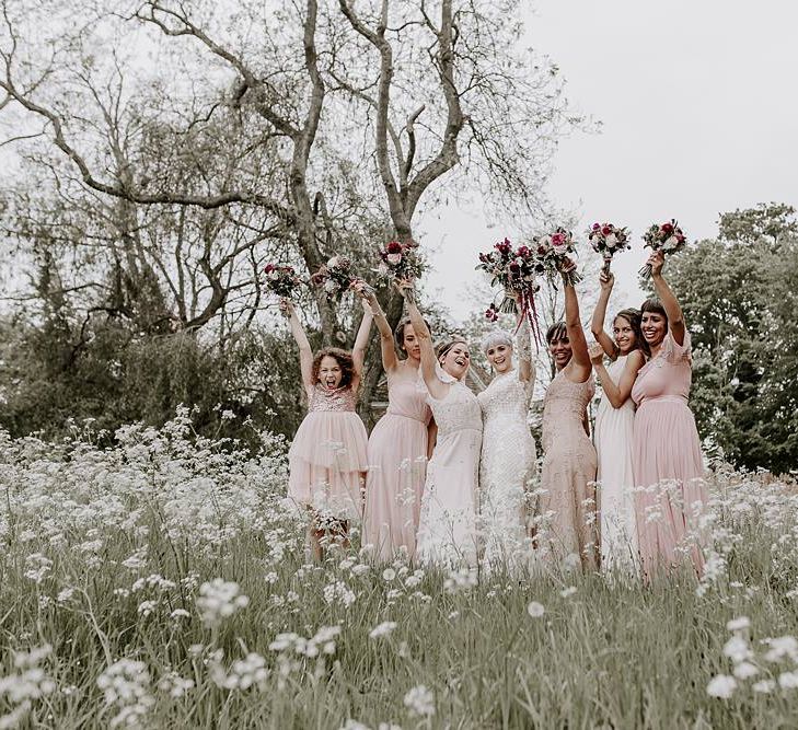 Bridal party portrait with bridesmaids in pink dresses