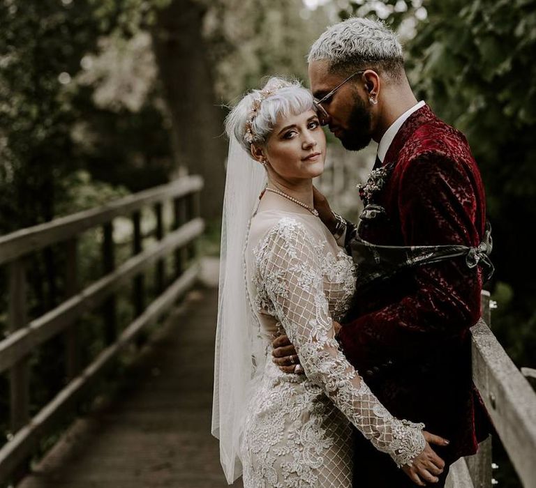 Bride in long sleeved Lillian West wedding dress