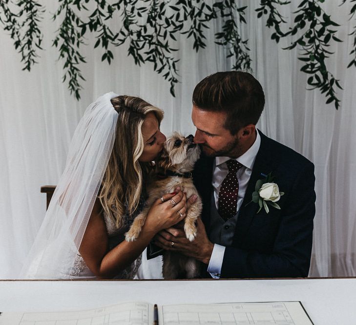 Signing of Register | Ralf the Dog | Bride in Lace Racerback Essence of Australia Wedding Dress | Groom in Navy Suit from Coneys of Lincoln | Nottinghamshire Wedding with Spanish Vibes and Rewritten Bridesmaids Dresses | Kev Elkins Photography