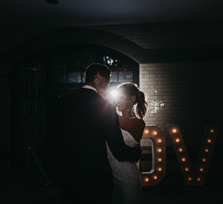 First Dance | Love Letter Lights | Bride in Lace Racerback Essence of Australia Wedding Dress | Groom in Navy Suit from Coneys of Lincoln | Nottinghamshire Wedding with Spanish Vibes and Rewritten Bridesmaids Dresses | Kev Elkins Photography