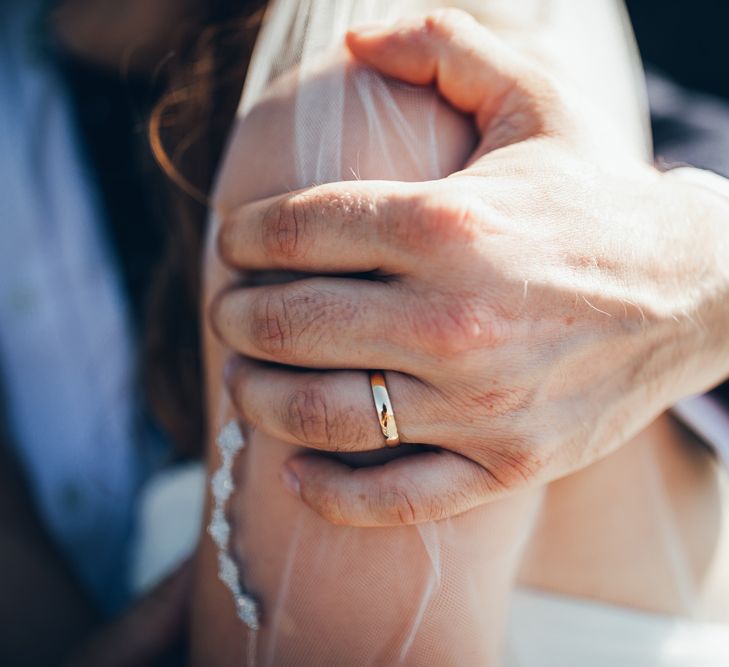 Gold Wedding Ring | Fingertip Veil with Edging | Gypsophila Arch and Giant Balloons for an Outdoor Coastal Wedding | Toby Lowe Photography