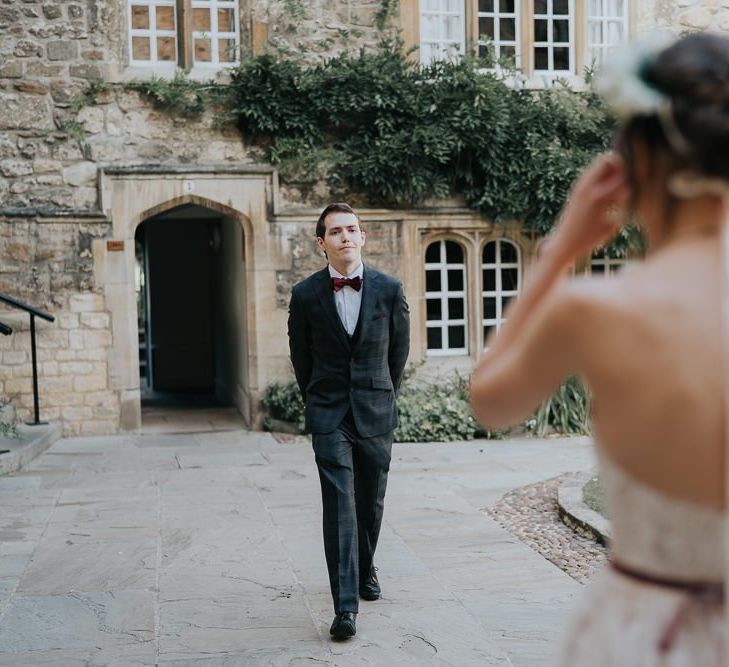 Bride and groom first look for intimate celebration with flower crown