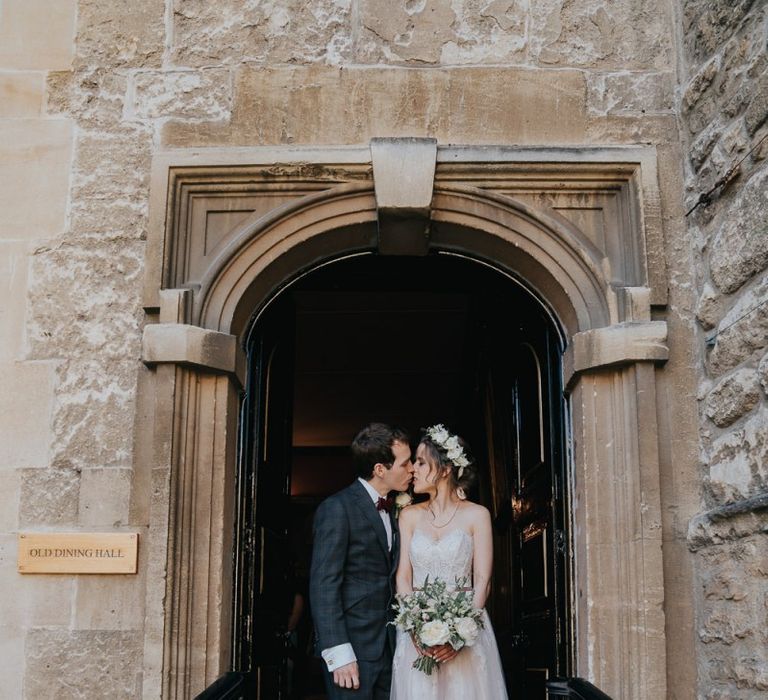 Bride and groom tie the knot at intimate civil ceremony with white bouquets and a harpist