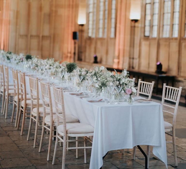 Bodleian library reception decor for intimate Oxford wedding with white floral decor and classic styling