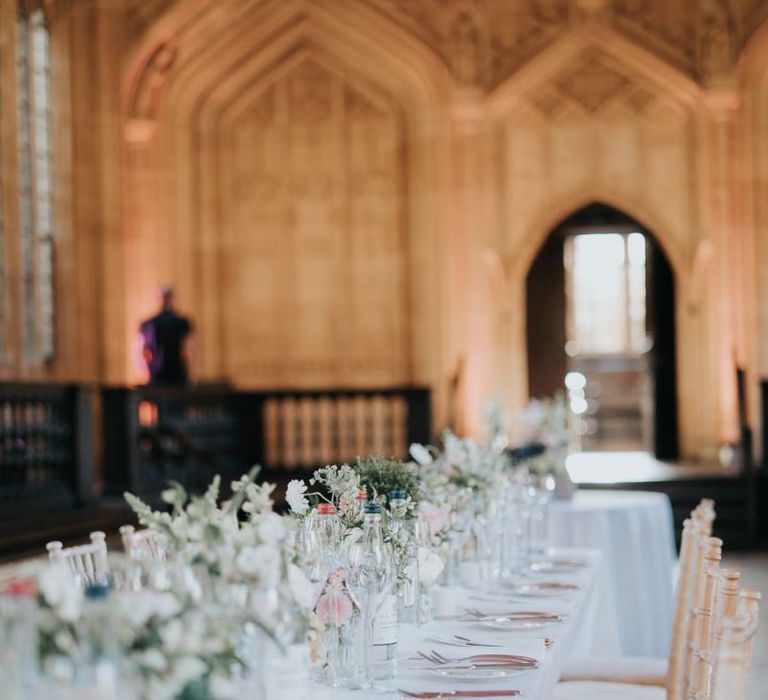 Bodleian library reception decor for intimate Oxford wedding with white floral decor and classic styling