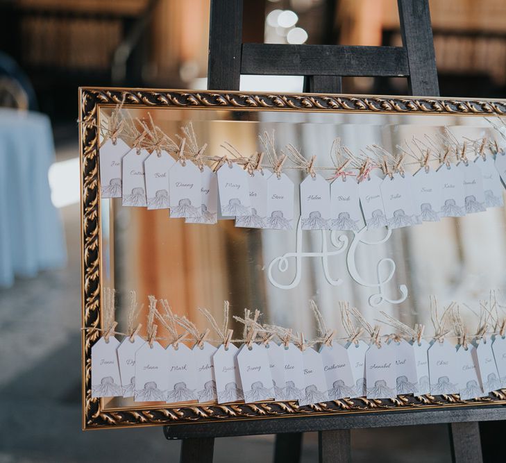 Mirror table plan with peg detail for intimate celebration with simple and classic styling