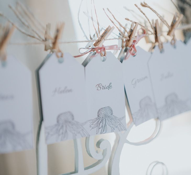 Mirror table plan with peg details for intimate celebration with simple and classic styling