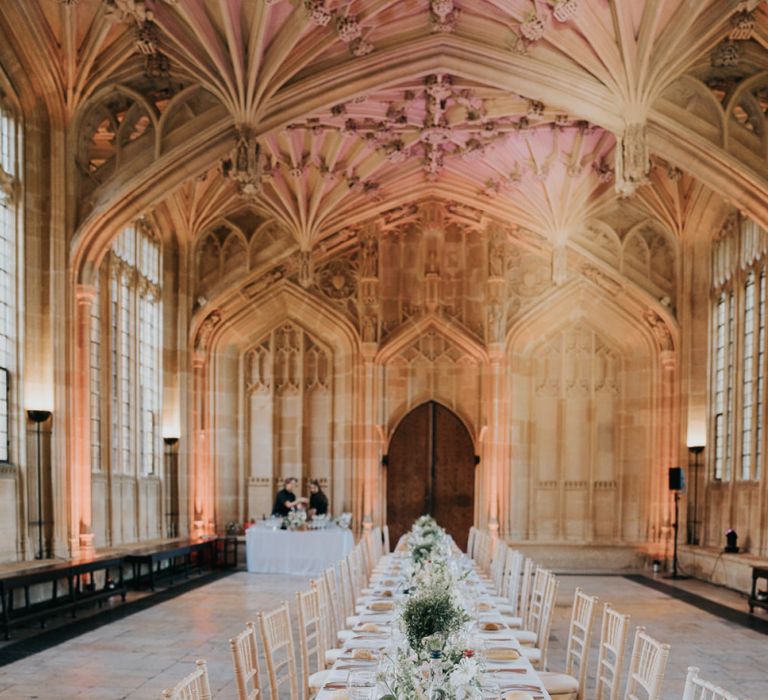 Bodleian library reception decor for intimate Oxford wedding with white floral decor and classic styling