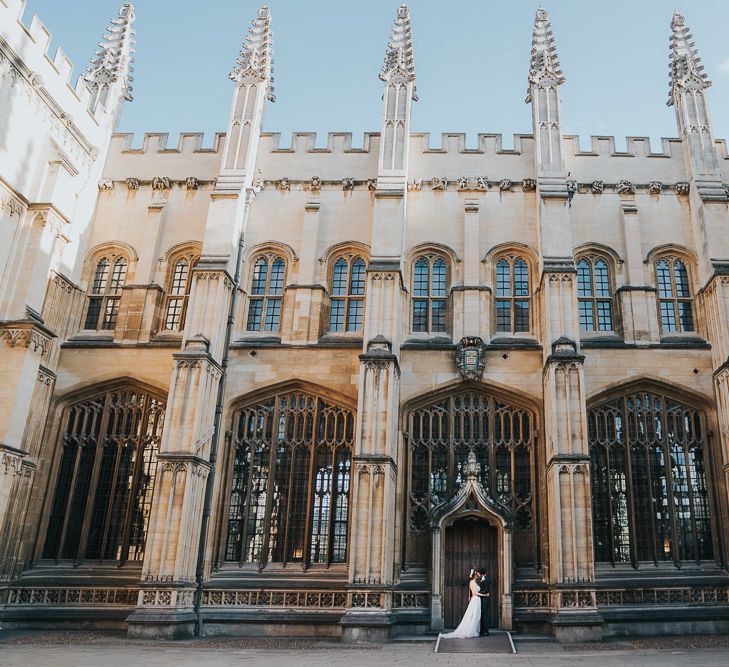 Bride and groom steal a moment at relaxed Oxford wedding reception at Bodleian library