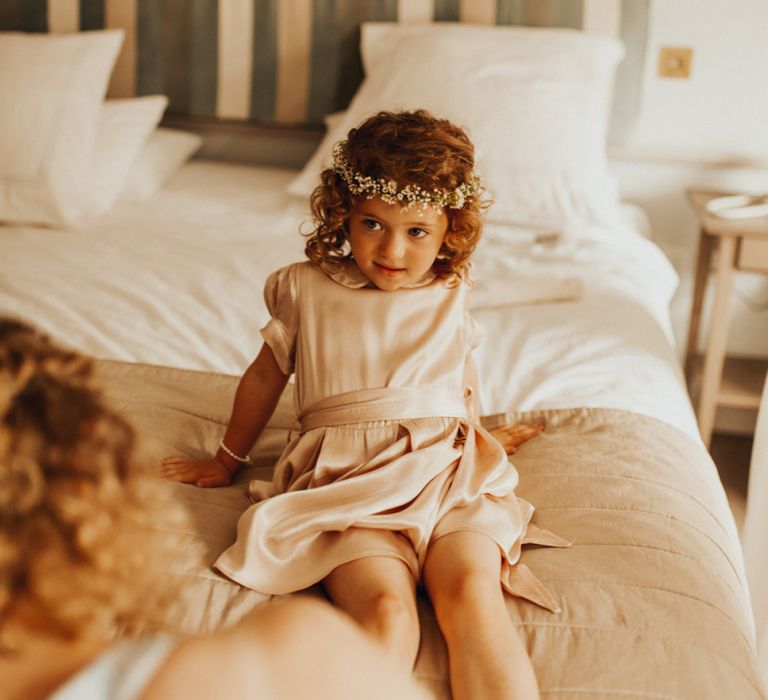 Flower girl in pink dress with flower crown