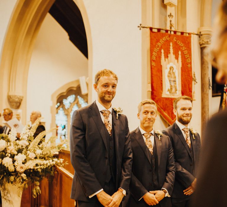 Groom waits for bride at altar