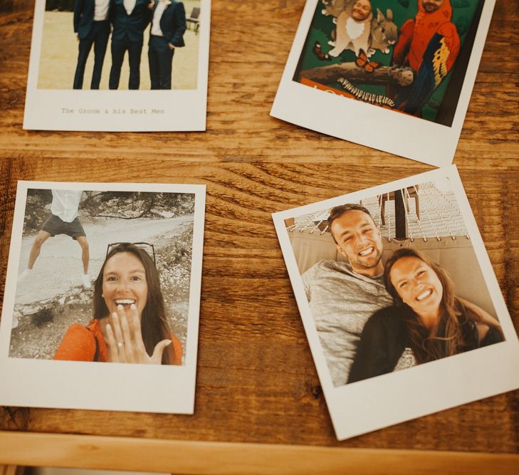 Polaroid pictures of couples love story with an abundance of flowers &amp;  foliage table runner decor