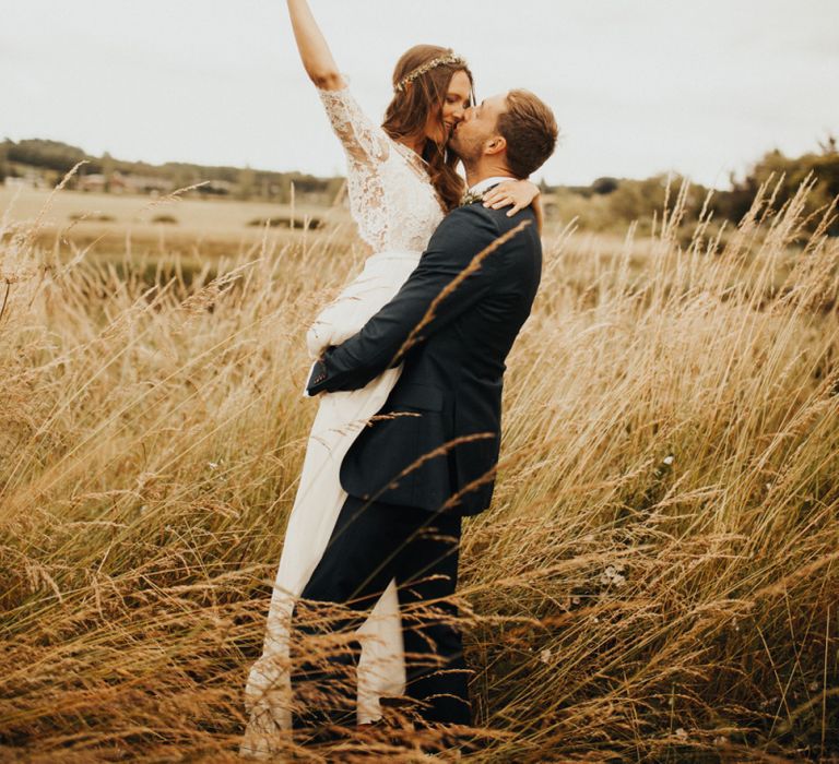 Bride and groom take some time in family garden