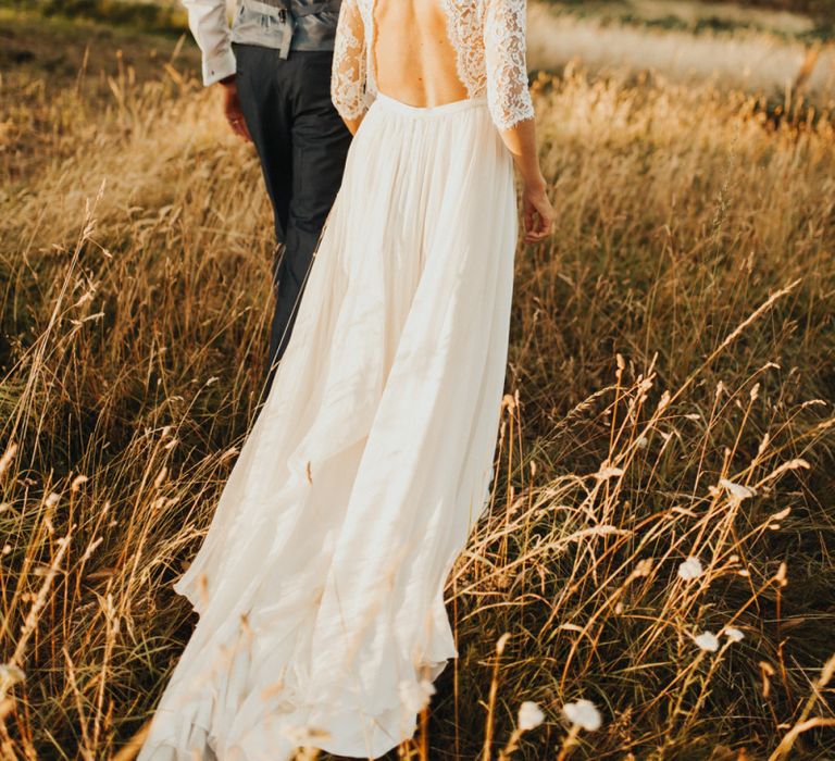 Open back lace sleeved wedding dress with flower crown