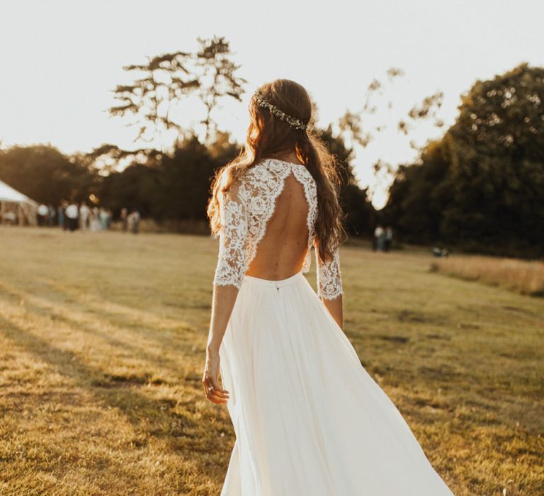 Open back lace sleeved wedding dress with flower crown