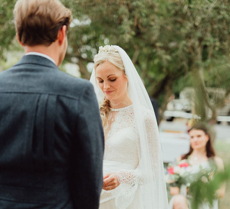 Wedding Ceremony | Bride in Laced Catherine Deane Wedding Dress with Long Sleeves | Rustic French Destination Wedding with Homegrown Flowers  | Emily &amp; Steve Photography