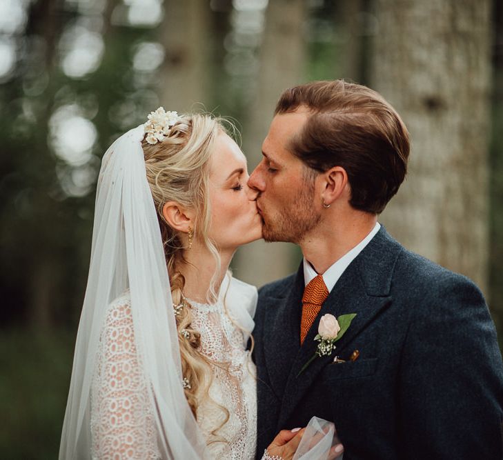 Bride in Laced Catherine Deane Wedding Dress with Long Sleeves | Groom in Blue Thomas Farthing Suit with Ochre Tie | Rustic French Destination Wedding with Homegrown Flowers  | Emily &amp; Steve Photography