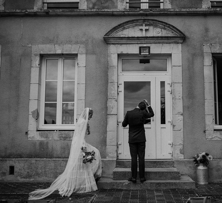 Bride in Laced Catherine Deane Wedding Dress with Long Sleeves | Groom in Blue Thomas Farthing Suit with Ochre Tie | Rustic French Destination Wedding with Homegrown Flowers  | Emily &amp; Steve Photography