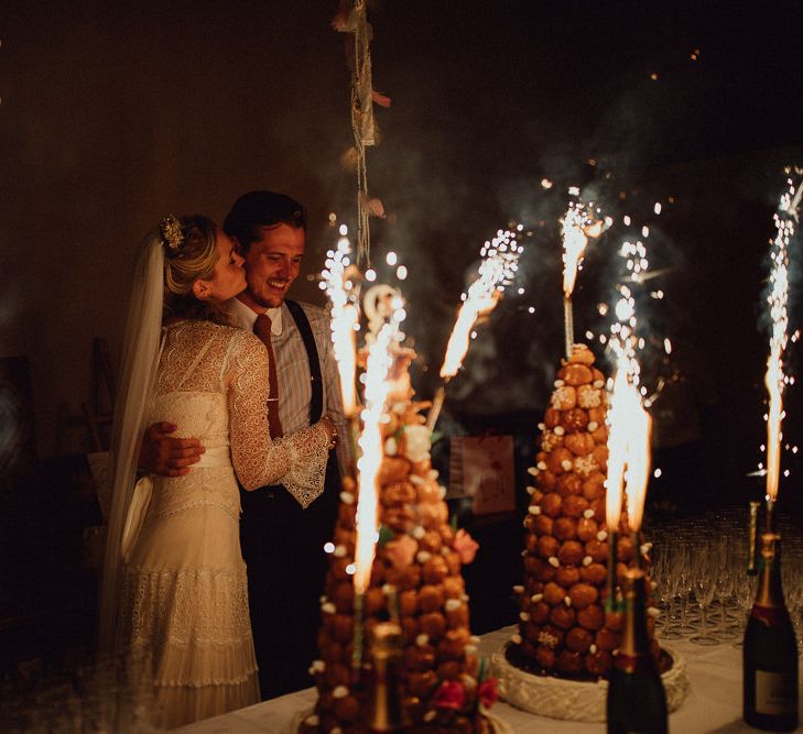 Croquembouche Cakes | Bride in Laced Catherine Deane Wedding Dress with Long Sleeves | Groom in Blue Thomas Farthing Suit with Ochre Tie | Rustic French Destination Wedding with Homegrown Flowers  | Emily &amp; Steve Photography