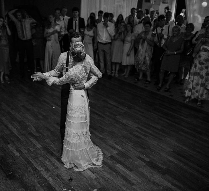 First Dance | Bride in Laced Catherine Deane Wedding Dress with Long Sleeves | Groom in Blue Thomas Farthing Suit with Ochre Tie | Rustic French Destination Wedding with Homegrown Flowers  | Emily &amp; Steve Photography