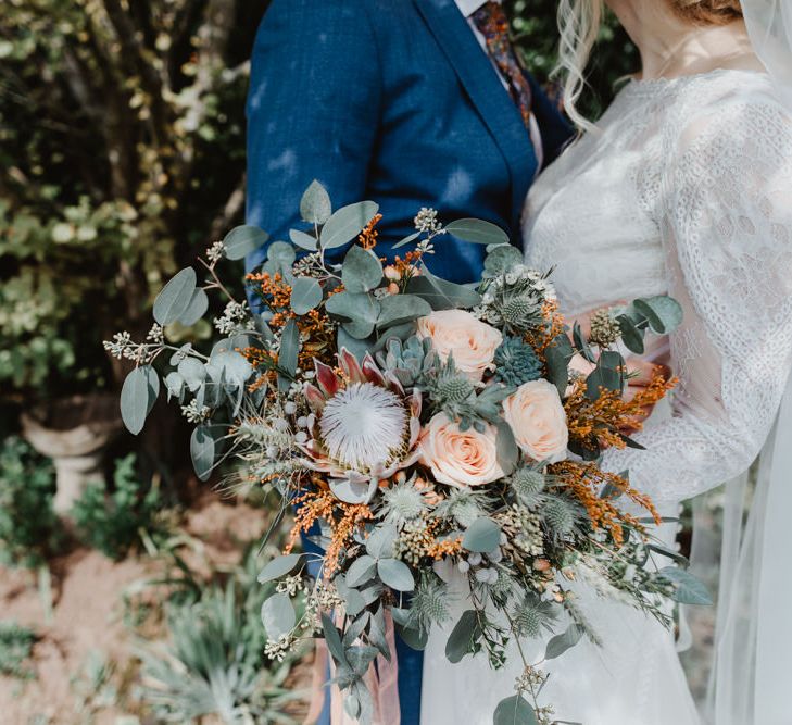 Wedding Bouquet with Eucalyptus, Peach Roses and Proteas