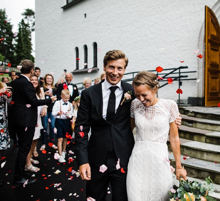 Confetti Exit | Bride in Lace Watters Wtoo Lenora Wedding Dress | Groom in Black Tie Suit | Woodland Wedding in Oslo, Norway | Through The Woods We Ran