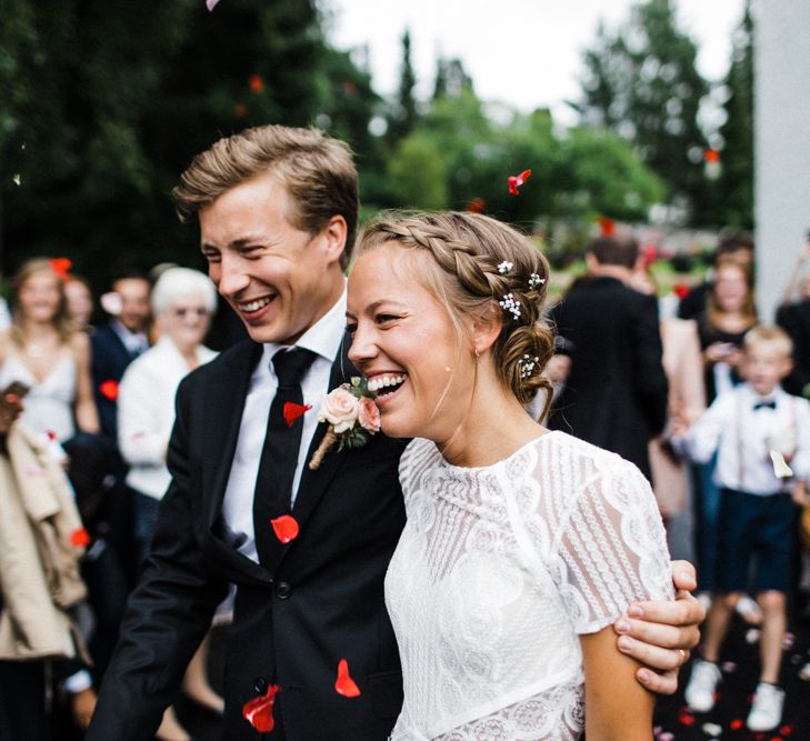 Confetti Exit | Bride in Lace Watters Wtoo Lenora Wedding Dress | Groom in Black Tie Suit | Woodland Wedding in Oslo, Norway | Through The Woods We Ran