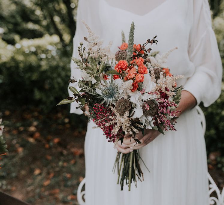 Bouquet With Orange Flowers // Bamboo Furniture For Destination Wedding In Spain With Planning From El Mono Con Sombrero With Images By AHR Photos Spanish Wedding Photography