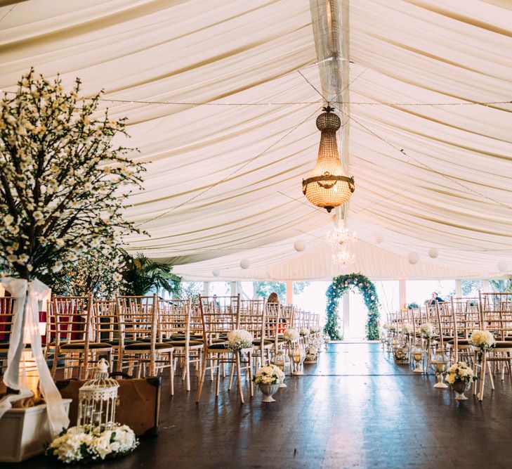 Ceremony Room at Tinakilly Country house with Trees and Floral Arch