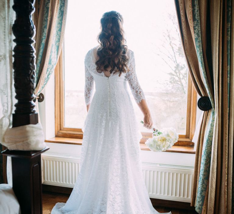 Bride in Lace Wedding Dress with Long Sleeves