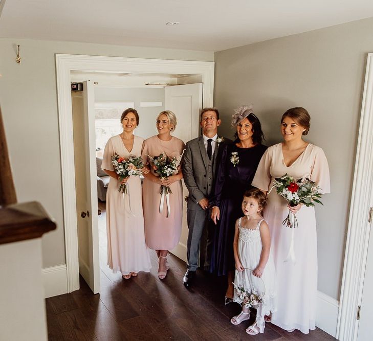 Bridal party see bride for first time at Norfolk barn wedding