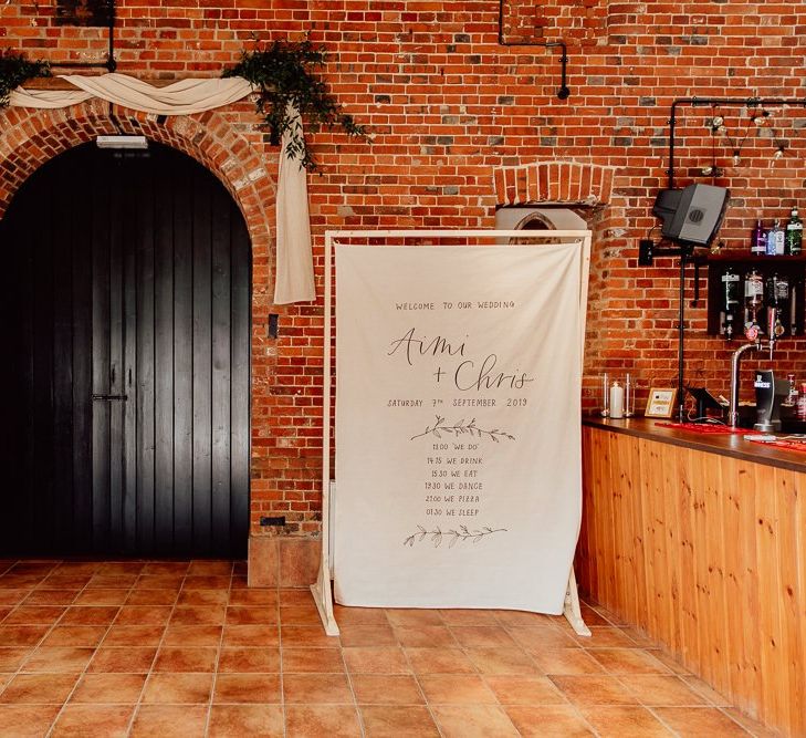 Norfolk barn wedding with linen sign