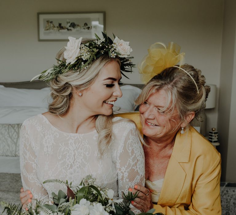 Bride and her mother getting ready for the ceremony